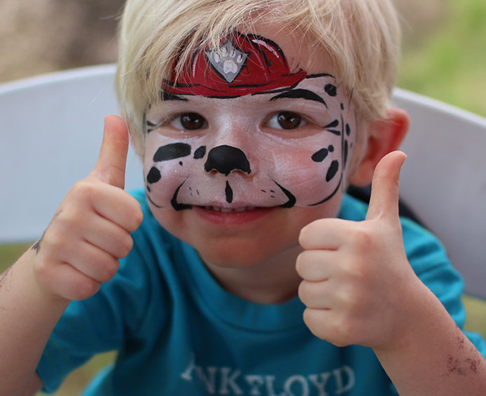 Face painting at a Houston community event
